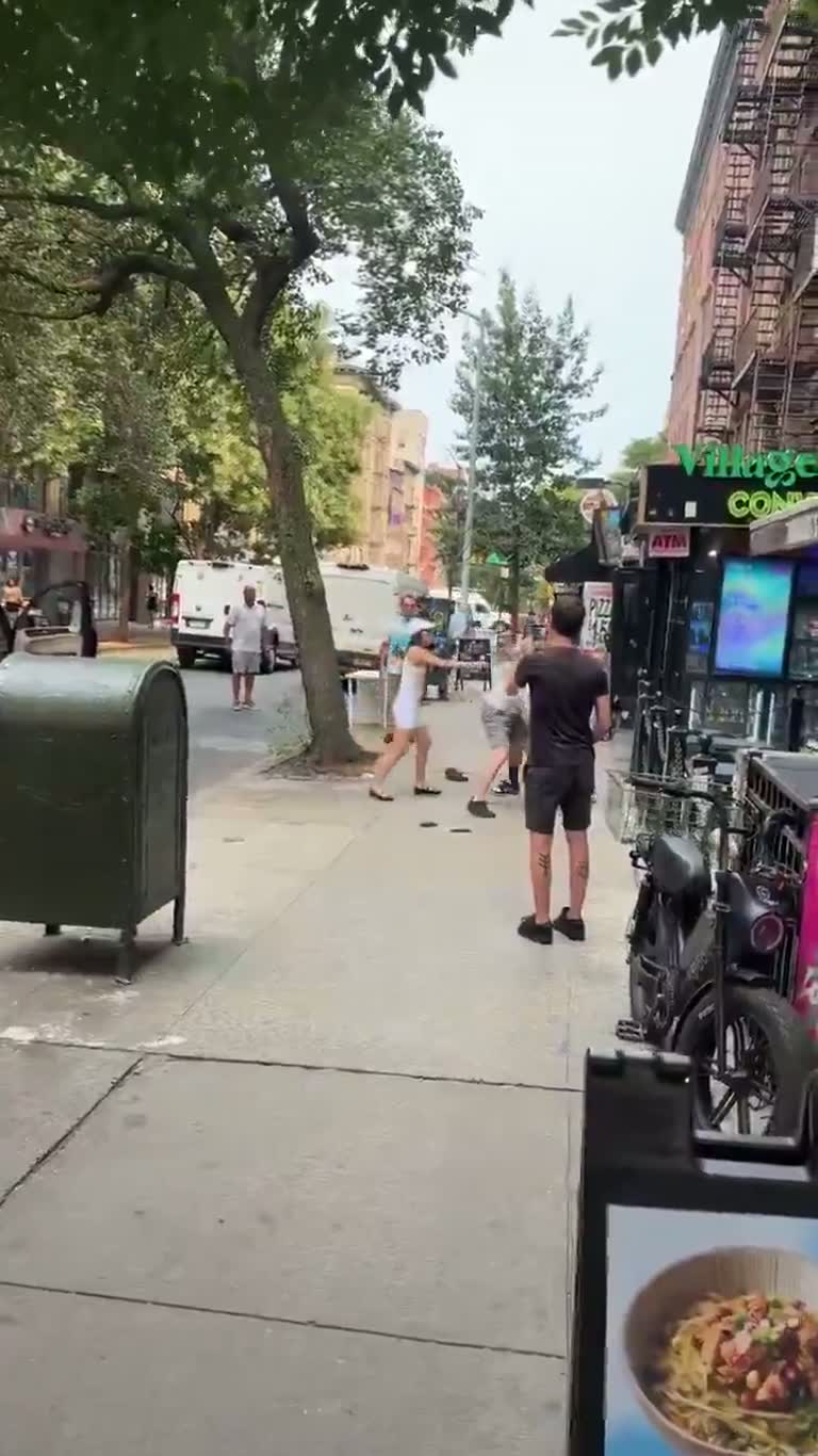 Chaos on a New York street as a car nearly hits a skateboarder