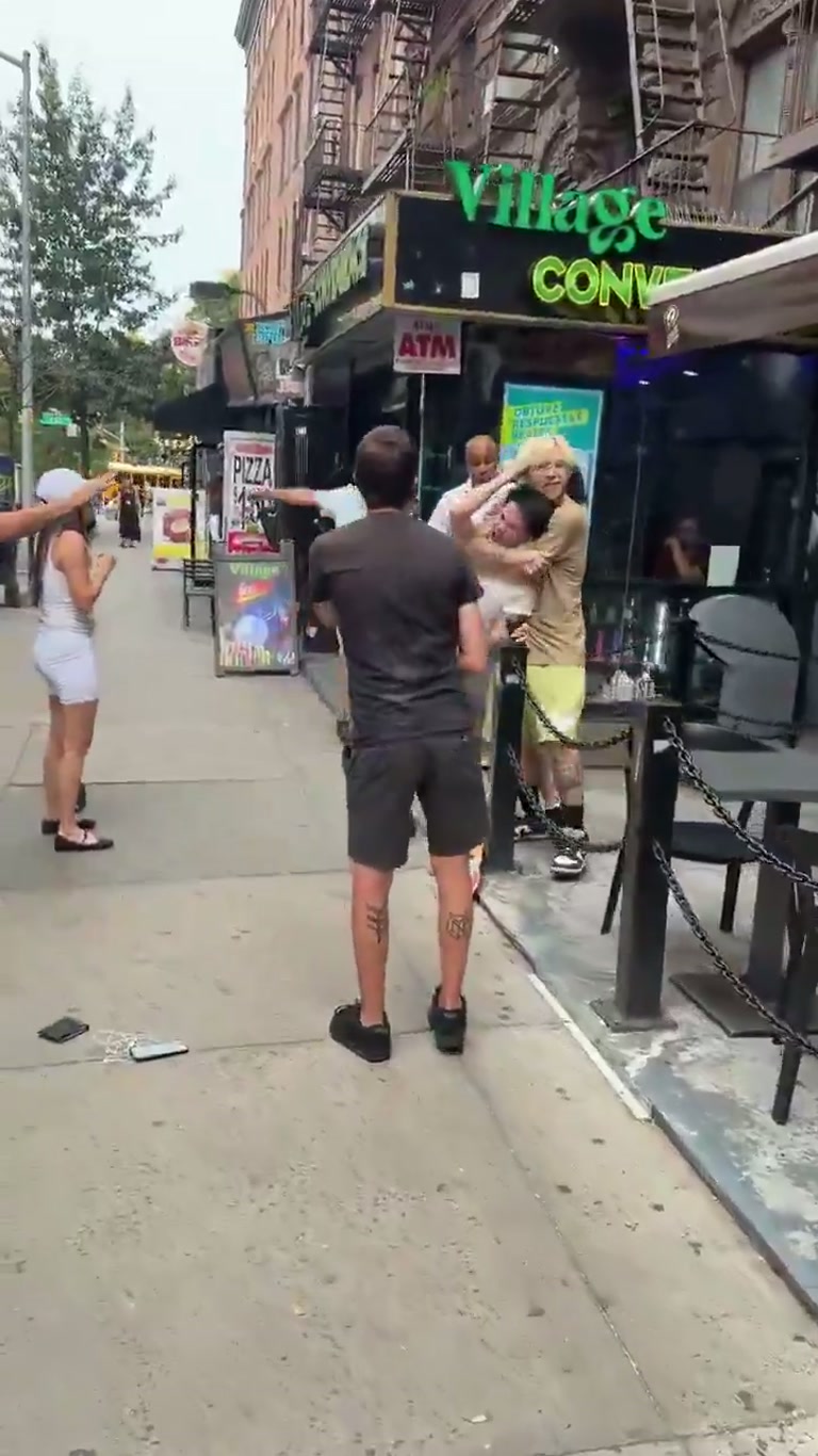 Chaos on a New York street as a car nearly hits a skateboarder