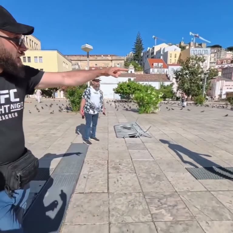 Tense square standoff as man armed with stone is told to leave