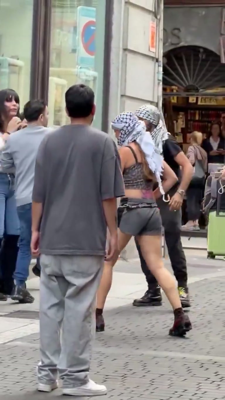 Madrid street scuffle caught on camera as bystanders step in