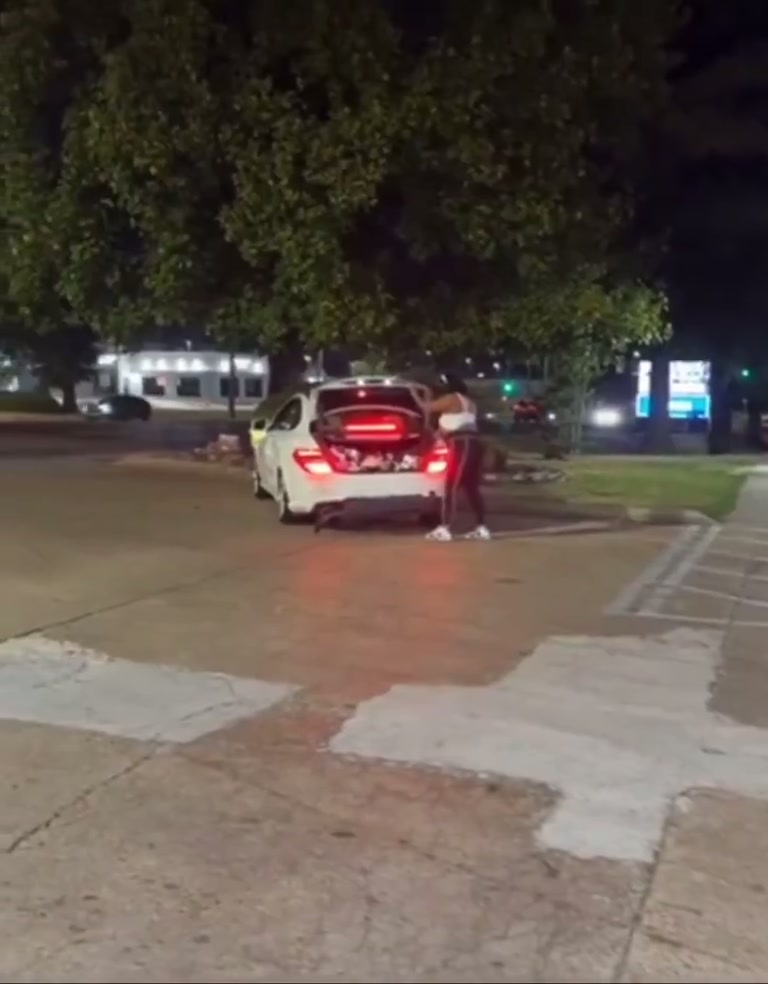 Night-time street standoff after car window shattered