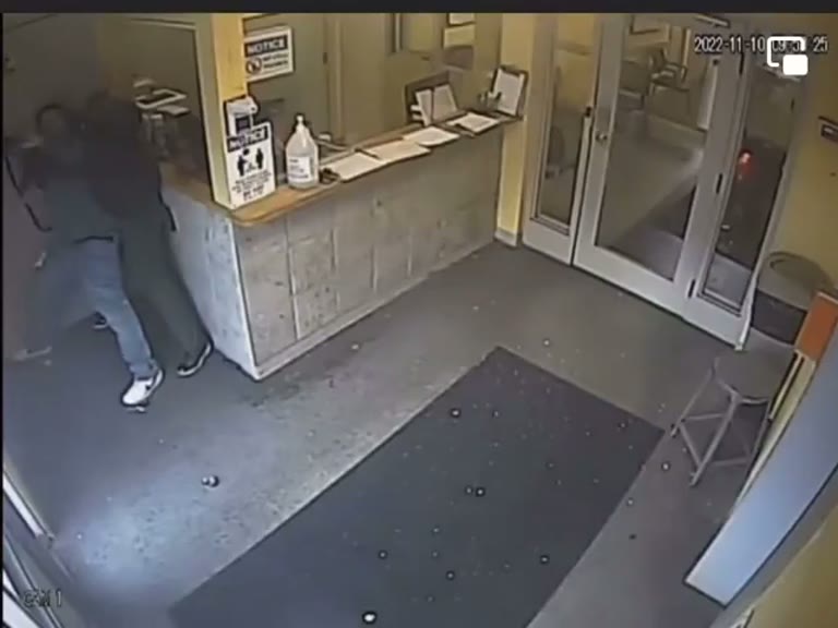 Moment Two Figures Clash at a Quiet Service Counter