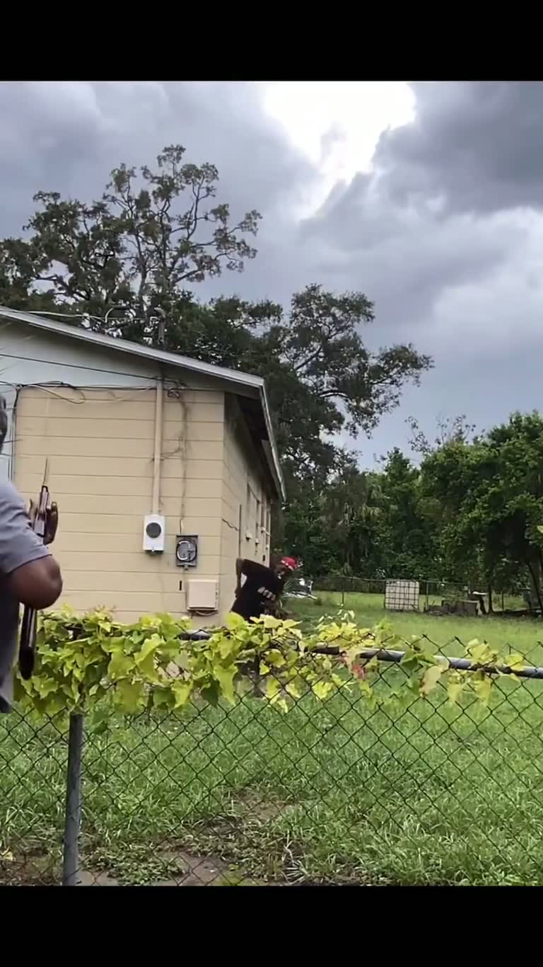 Tense standoff unfolds as man confronts intruder in backyard