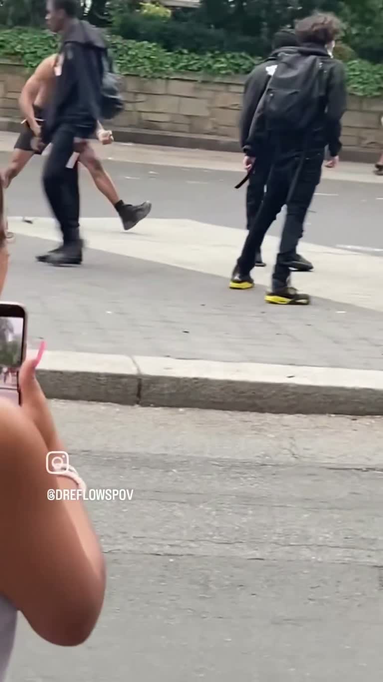 Chaotic street brawl erupts as onlookers watch in disbelief