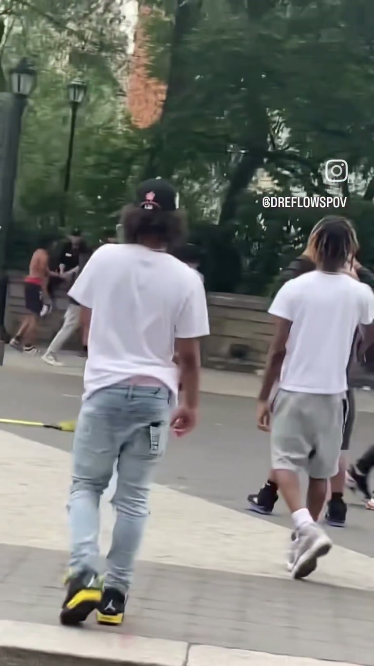 Chaotic street brawl erupts as onlookers watch in disbelief