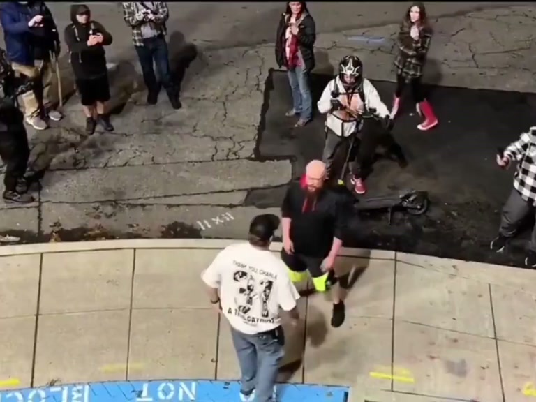 A tense street confrontation leaves one man on the ground